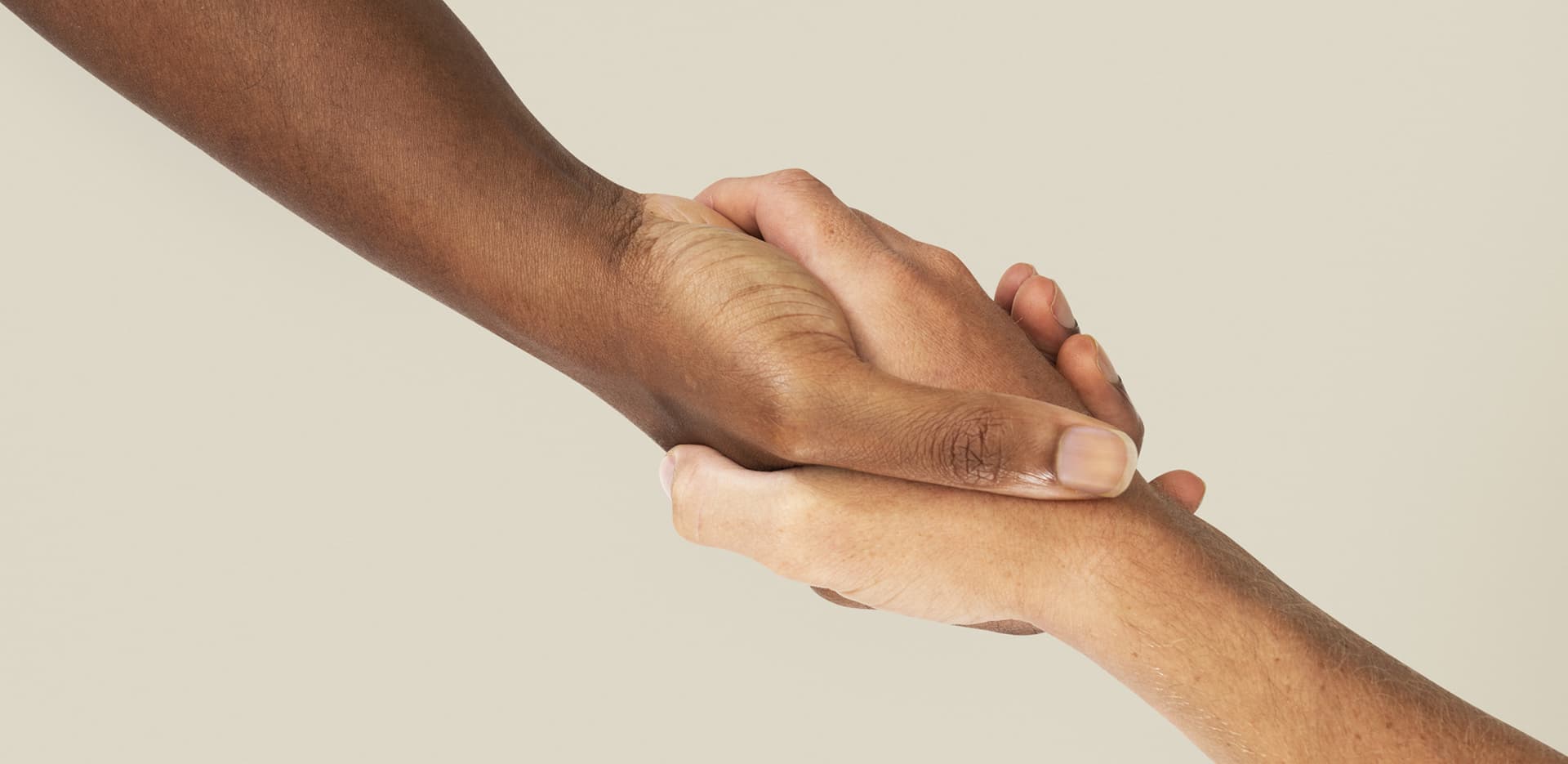 Two hands clasped together in support